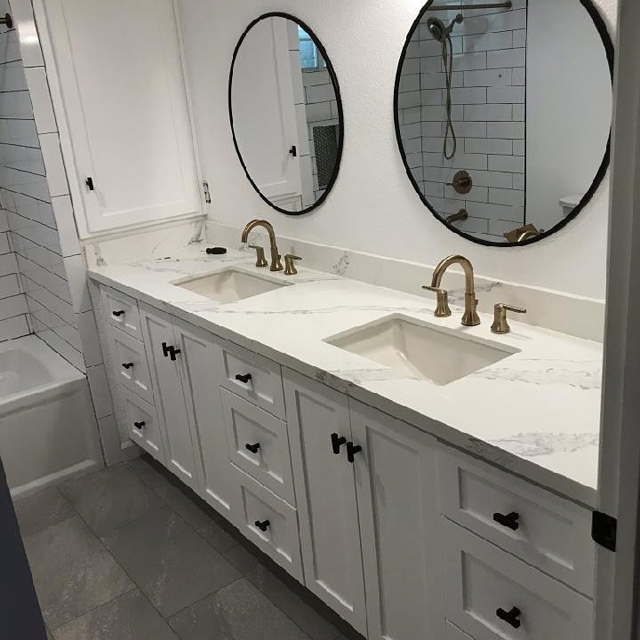Bathroom vanity with double sinks and grey tile flooring installed by Sulcas Carpets & more in Elk Grove, CA
