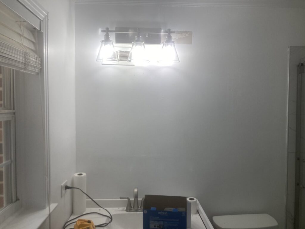 A bright bathroom vanity light fixture installed by Goodie's Electrical Contractors LLC in Dothan, AL