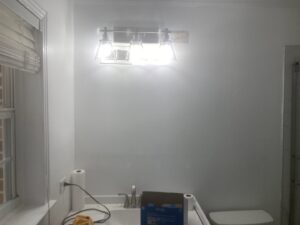 A bright bathroom vanity light fixture installed by Goodie's Electrical Contractors LLC in Dothan, AL