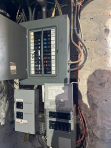 Modern bathroom vanity with new lighting fixtures and backlit mirrors installed by Border Electrical Contractor LLC in Nashua, NH.