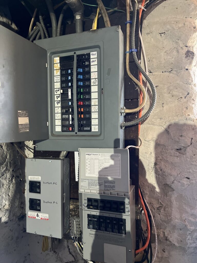 Modern bathroom vanity with new lighting fixtures and backlit mirrors installed by Border Electrical Contractor LLC in Nashua, NH.