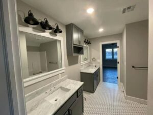 Bathroom featuring vanity sconces and recessed lighting installed by Innovative Electric in Wichita, KS.