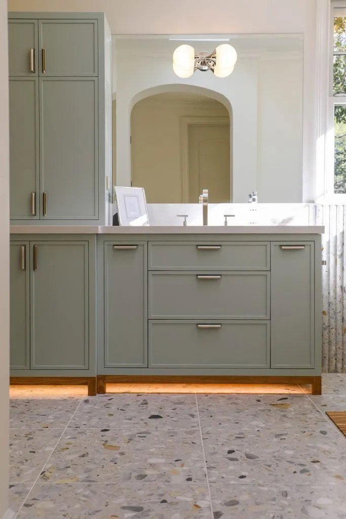 Bathroom vanity with a modern light fixture and under-cabinet lighting installed by R.C Electric, Inc. in San Francisco, CA
