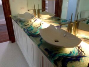 A bathroom vanity with decorative under-counter lighting installed by Christensen Electric in Galveston, TX.