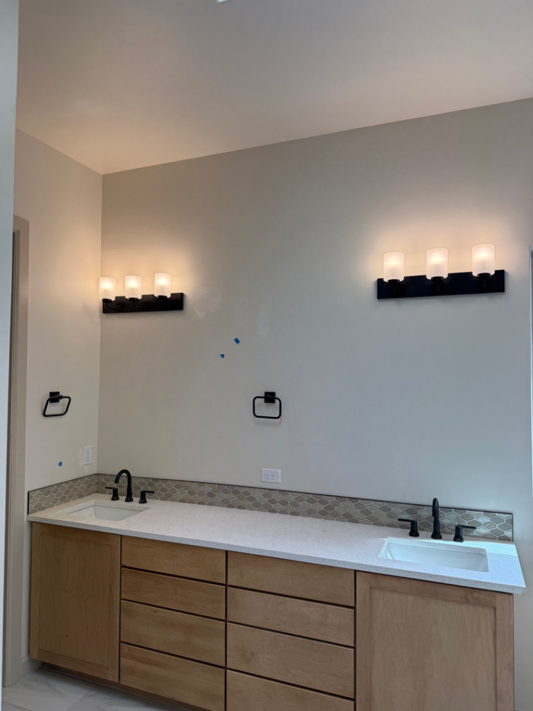 New bathroom vanity wall sconces and electrical outlet installation by O'Dell Electrical Services in Albuquerque, NM.