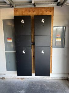 Installation of battery storage units and electrical panels by TJAM Electric in Springtown, TX.