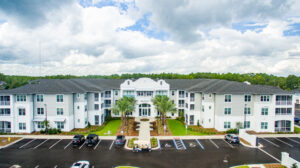 Aerial view of Beacon apartment complex with solar panels installed by Performance Electrical Contracting Inc. in Jacksonville, FL