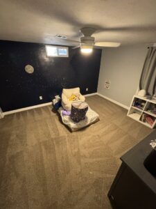 A bedroom with brown carpet showing fresh cleaning patterns by Pueblo's Best Carpet & Air Duct Cleaning in Pueblo West, CO.