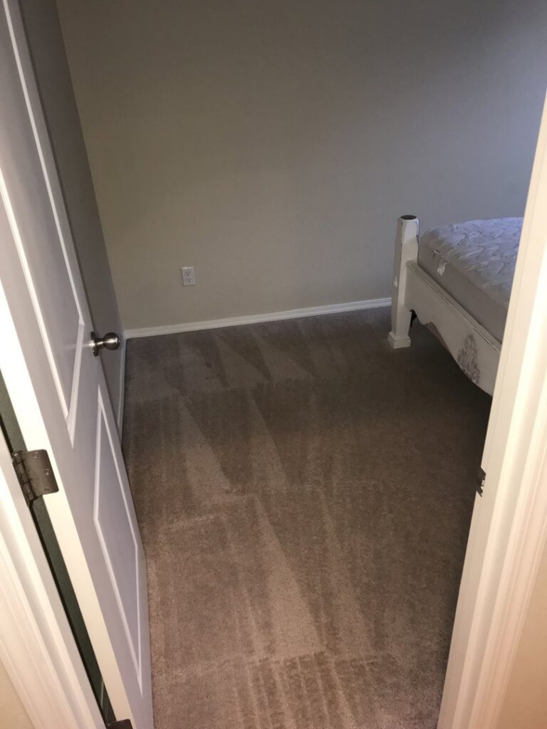 A bedroom carpet with visible cleaning lines after professional service by Achilles Carpet Cleaning in Vancouver, WA.