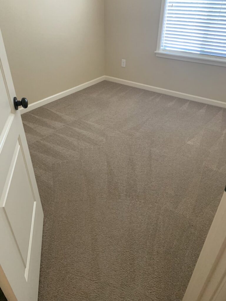 A bedroom carpet with distinct cleaning lines after professional service by Achilles Carpet Cleaning in Vancouver, WA.