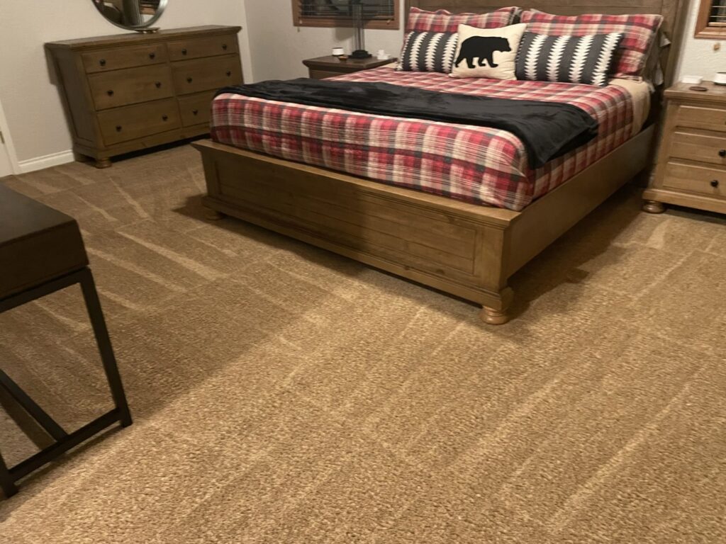 A bedroom carpet showing fresh cleaning lines after professional service by Interior Care Carpet Cleaning in Bend, OR.