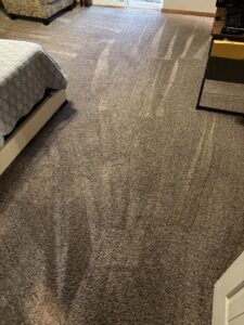 A bedroom carpet showing clean lines after professional steam cleaning by LNC Steam Cleaning in Owasso, OK.