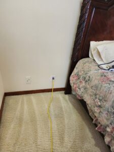 A bedroom carpet freshly cleaned with visible lines, showcasing the work of A&g's carpet cleaning service in Vancouver, WA.