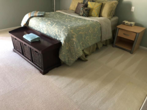 A bedroom carpet showing fresh cleaning lines after service by Cleaning Service Pro, LLC in Peoria, AZ