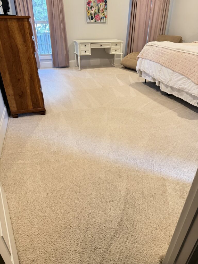 A bedroom carpet showing fresh cleaning lines after service by Jones Carpet Care LLC in Huntsville, AL.