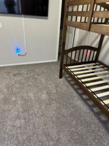 Professional carpet installation in a bedroom, showcasing work by Cruz Carpet / Vidal Cruz in Colorado Springs, CO