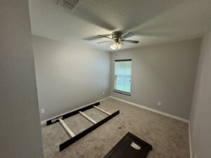 A newly installed light brown carpet in a bedroom by First Quality Carpets Inc. in Orlando, FL