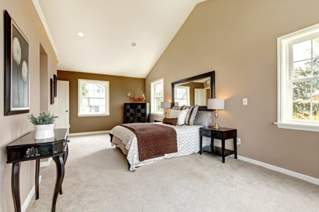 A spacious bedroom featuring new, plush carpet installed by Floors Touch in McKinney, TX.
