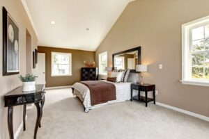 A spacious bedroom featuring new, plush carpet installed by Floors Touch in McKinney, TX.
