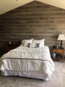 A comfortable bedroom featuring new carpet installation by Great Northern Flooring in Bensenville, IL.