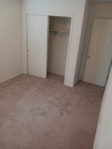 Newly installed light brown carpet in a bedroom by Lansa Works, a professional carpet contractor in Phoenix, AZ