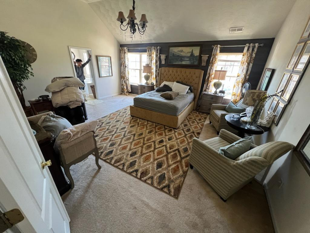 A comfortable bedroom with a freshly installed carpet and an area rug by VA Carpet Connection LLC in Chesapeake, VA.