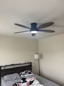 A new ceiling fan installed in a bedroom by Abe Electric LLC, providing comfort in Wallingford, CT.