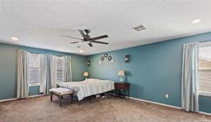 Bedroom with a newly installed ceiling fan and recessed lighting by Lindsey and Son Electric, LLC in Summerville, SC