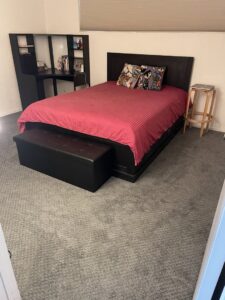 A spacious bedroom with a newly installed gray carpet by Footprints Floors LA / San Fernando Valley in Studio City, CA.