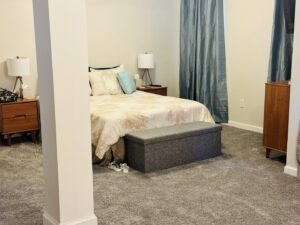 A spacious bedroom featuring soft gray carpet installed by Rocky Flooring in Greer, SC.