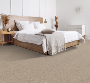 Freshly installed light brown carpet in a bedroom by Son Shine Floor Covering LTD, a trusted carpet contractor in Warren, MI.