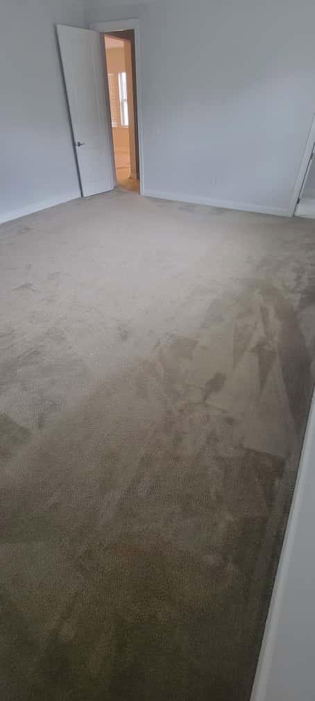 A bedroom featuring newly installed light brown carpet by Stellar Remodeling in Maggie Valley, NC