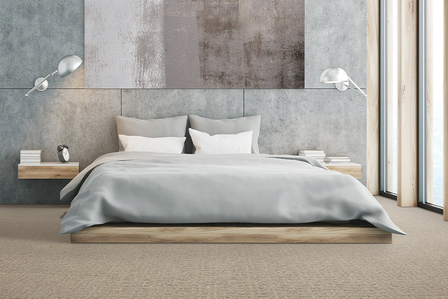 A bedroom with light beige carpet installed by Seacoast Flooring in Saco, ME.