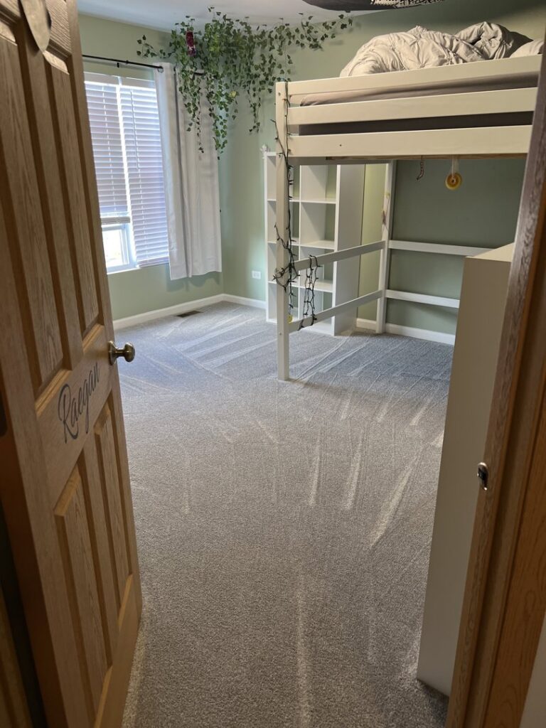 A child's bedroom with a new light grey carpet and a white bunk bed installed by Rosas Carpet & Flooring in Shorewood, IL.