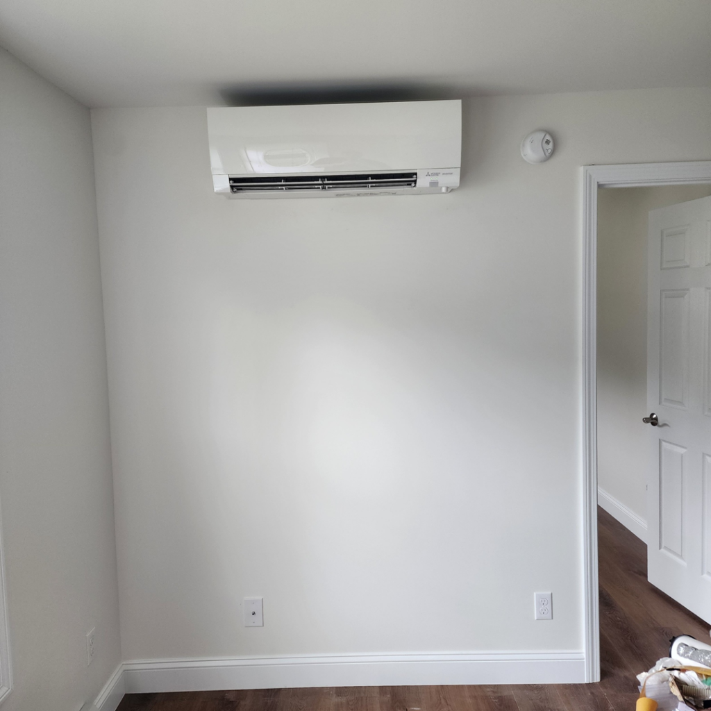 A mini-split heat pump unit installed in a bedroom for heating and cooling by Element Heat Pumps in Gray, ME.