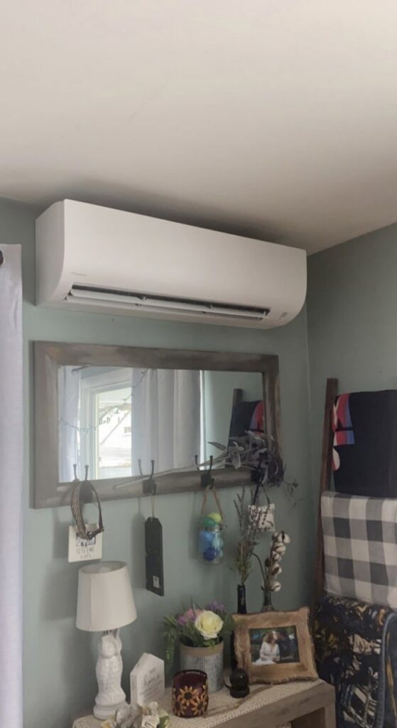 An indoor mini-split unit installed on a bedroom wall by Laird's HVAC in Auburn, ME.