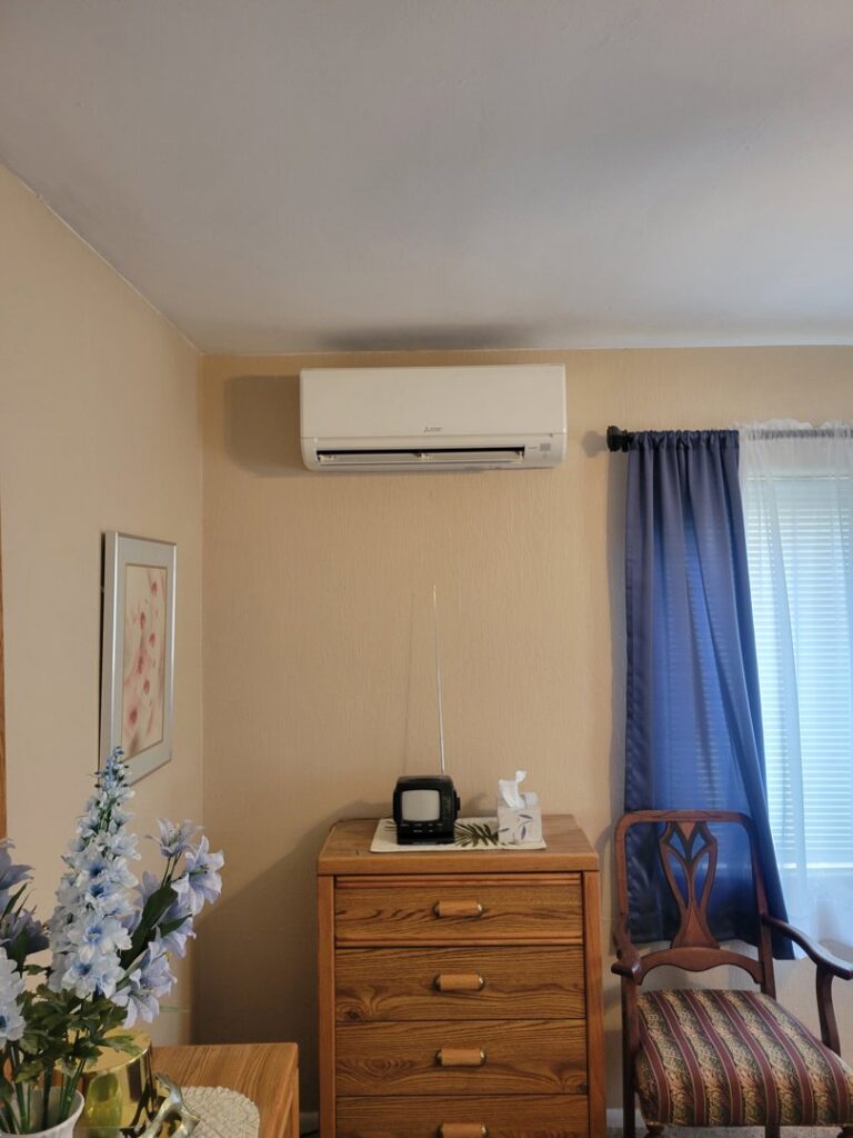 A mini-split air conditioning unit installed in a bedroom by Pacheco Air Conditioning and Heating LLC in Albuquerque, NM.