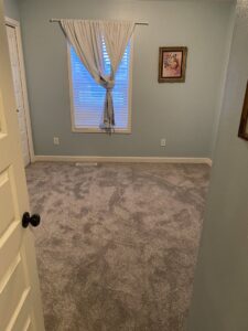 A bedroom featuring new gray carpet installation by IDF The Floor Store in Idaho Falls, ID.