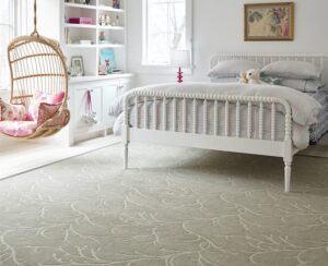 A newly installed light-colored patterned carpet in a bedroom by Custom Crafted Floors in Phoenix, AZ.