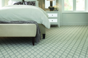 A stylish patterned carpet installed in a bedroom by West Michigan Flooring & Interiors, serving Grand Rapids, MI.