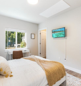 A comfortable bedroom showcasing a newly installed ceiling radiant heating and cooling panel by Mighty Energy Solutions in Seattle, WA.