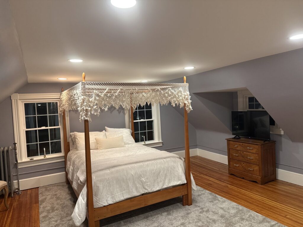 A bedroom featuring newly installed recessed lighting in the ceiling by EPOS Systems, Inc. in West Springfield, MA.