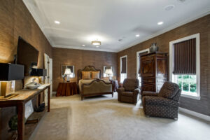 A spacious bedroom featuring a light-colored wall-to-wall carpet installed by Adda Carpet and Flooring in New Orleans, LA.