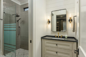 A clean bedroom featuring freshly installed grey carpet by Dalton Wholesale in Adairsville, GA.