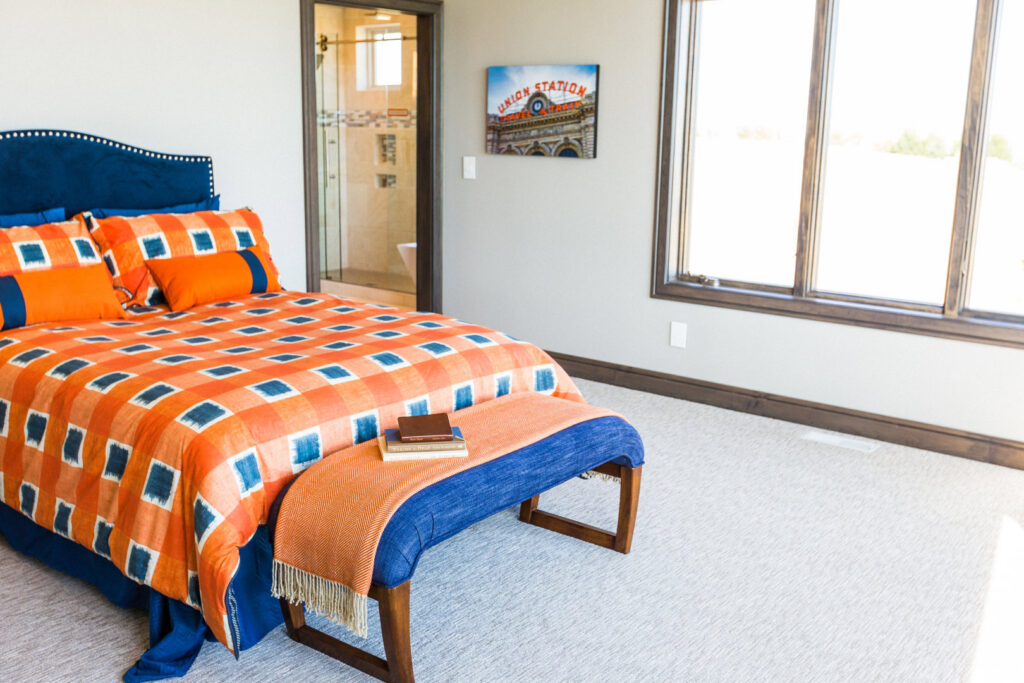 A cozy bedroom featuring freshly laid light-colored carpet by Floors & More Abbey Flooring in Great Falls, MT.