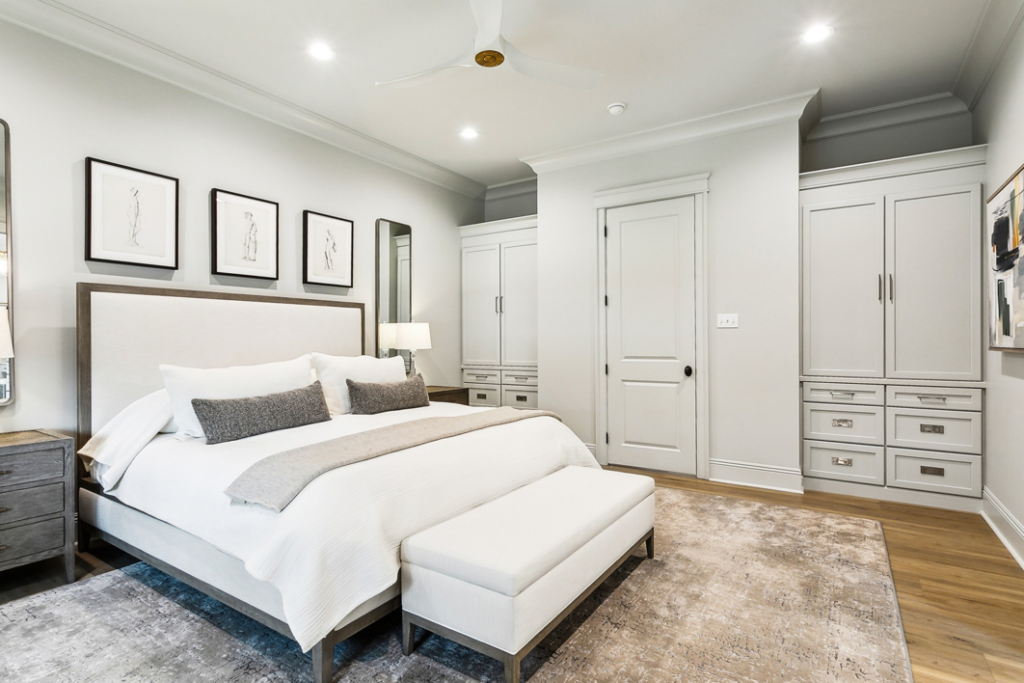 A spacious bedroom featuring a large, textured area rug installed by Adda Carpet and Flooring in New Orleans, LA.
