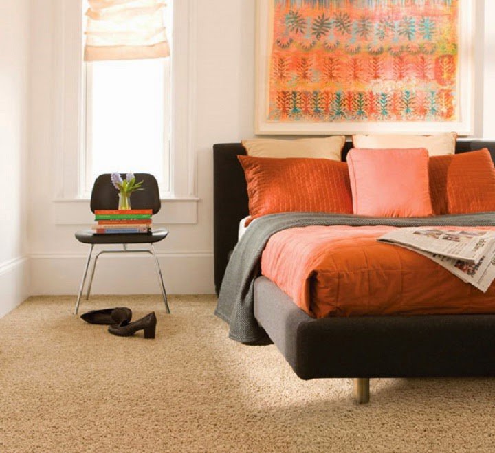 A cozy bedroom showcasing a fresh carpet installation by Wall To Wall Carpet One Floor & Home in Eau Claire, WI