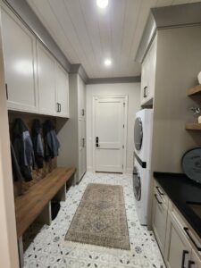 A bedroom showcasing new grey carpet installation and a modern bed frame by Dalton Wholesale in Adairsville, GA.