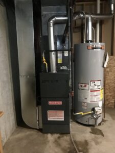 Before and after comparison of an old AC unit replaced with a new Goodman unit by Bellis Heating & Cooling in Independence, MO.