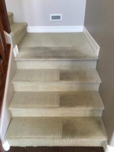 A before and after view of a carpeted staircase being cleaned by Healthy Living Carpet & Tile Cleaning in Peoria, AZ.